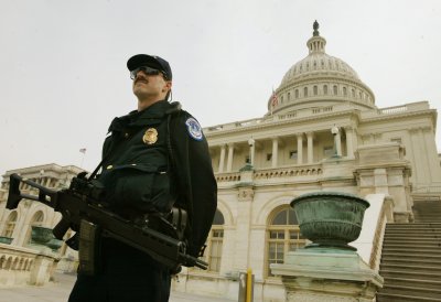 Infowars Issues Emergency Terror Alert a heavily armed police officer stands guard on the front steps of the capitol in washington dc tuesday march 18 2003 with war in iraq likely in just days the homeland security department raised the national terror alert to orange indicating a high risk of terrorism against american interests ap photocharles dharapak